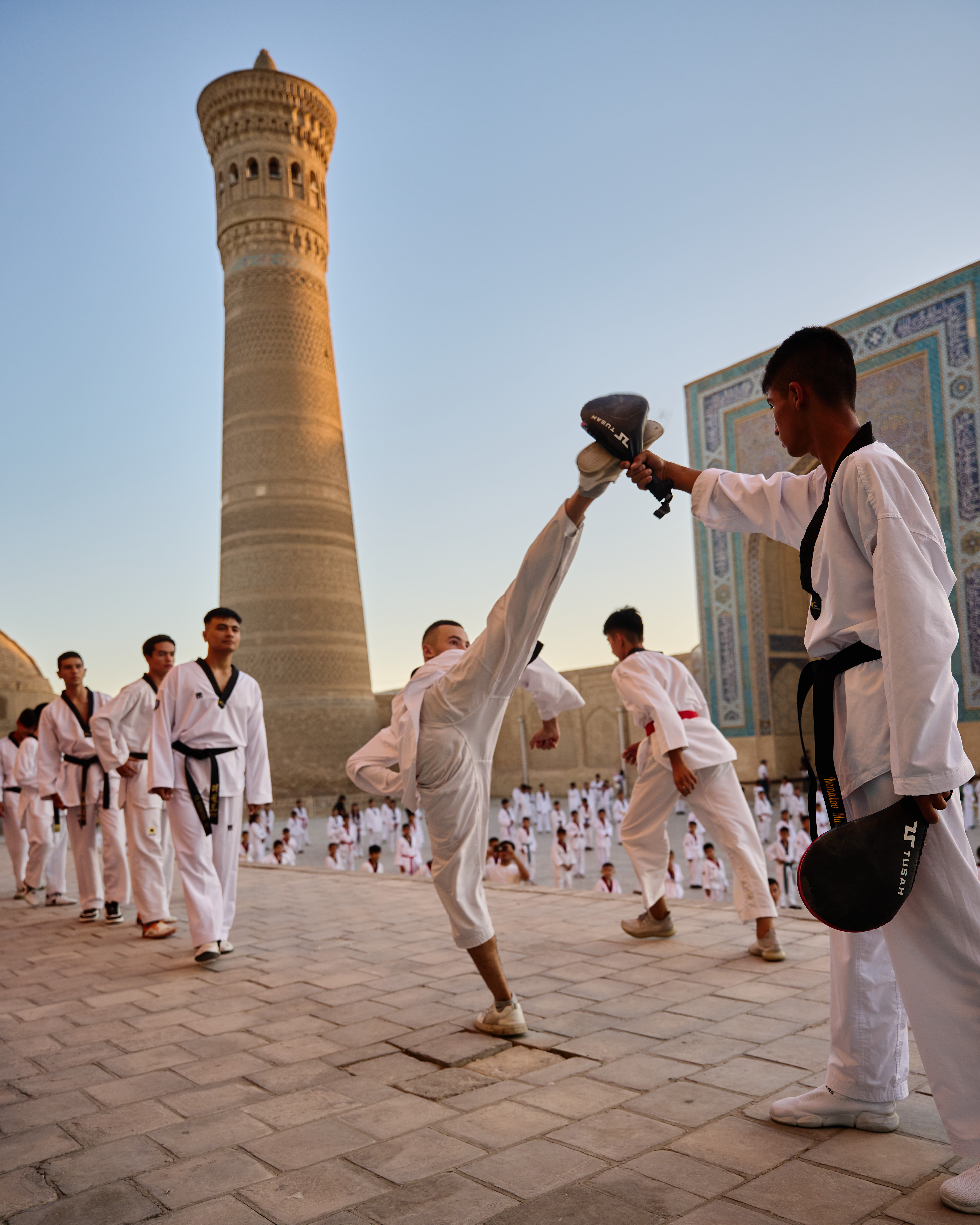 Large martial arts exhibition against a background of Islamic architecture